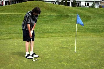Putting on first hole at Riverridge Nine
