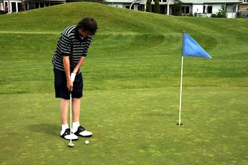 Putting on first hole at Riverridge Nine