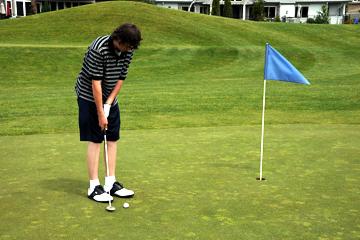 Putting on first hole at Riverridge Nine