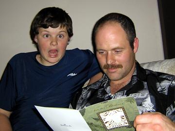 Me and dad check out Christmas card - December 24, 2006